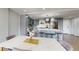 Modern kitchen with a center island, stainless steel appliances, and a chandelier at 400 Island Way # 210, Clearwater Beach, FL 33767