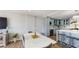 Bright kitchen and dining area with a large island and stainless steel appliances, perfect for entertaining at 400 Island Way # 210, Clearwater Beach, FL 33767