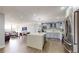 Open concept with an island kitchen that flows into the dining and living areas at 400 Island Way # 210, Clearwater Beach, FL 33767