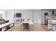Inviting living area open to a kitchen with stainless steel appliances and dining table at 400 Island Way # 210, Clearwater Beach, FL 33767