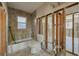Partially renovated bathroom with a tub, tile accents, and the opportunity for personalized upgrades at 401 Patica Ne Rd, St Petersburg, FL 33702