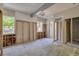 Neutral living room featuring wood floors and bright windows, perfect for personalized design and natural light at 401 Patica Ne Rd, St Petersburg, FL 33702