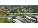 Wide aerial view of the neighborhood with nearby ponds and mature landscaping at 4148 102Nd N Pl, Clearwater, FL 33762
