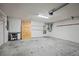 Spacious garage with shelving and overhead door at 4148 102Nd N Pl, Clearwater, FL 33762