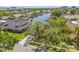 Aerial view of home and neighborhood with waterfront access, boat docks, and mature trees at 4226 Saltwater Blvd, Tampa, FL 33615