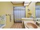 Bathroom featuring a shower with a decorative curtain, a light-toned counter, and a sink at 4226 Saltwater Blvd, Tampa, FL 33615