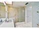 A well-lit bathroom with a walk-in shower and an ample amount of storage at 4226 Saltwater Blvd, Tampa, FL 33615