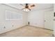 A cozy bedroom with a ceiling fan and a window that lets in natural light at 4226 Saltwater Blvd, Tampa, FL 33615
