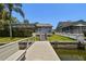 A wooden dock and waterfront with scenic views, set against a backdrop of clear skies at 4226 Saltwater Blvd, Tampa, FL 33615