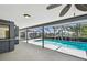 A screened-in lanai with a pool that has a view of the waterfront at 4226 Saltwater Blvd, Tampa, FL 33615