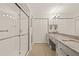 Bright bathroom featuring a double vanity, modern fixtures, and a glass-enclosed shower at 476 Santa Cruz Ne Pl # C, St Petersburg, FL 33703