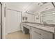 Bright bathroom featuring a double vanity, modern fixtures, and a glass-enclosed shower at 476 Santa Cruz Ne Pl # C, St Petersburg, FL 33703