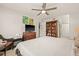 Bright bedroom features a ceiling fan and built-in bookcase, enhancing the space at 476 Santa Cruz Ne Pl # C, St Petersburg, FL 33703
