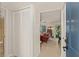Comfortable living room view from the entry featuring hardwood floors and sliding glass doors at 476 Santa Cruz Ne Pl # C, St Petersburg, FL 33703