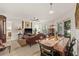 Bright living room with adjacent dining area features stylish furniture and decor at 476 Santa Cruz Ne Pl # C, St Petersburg, FL 33703