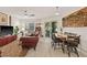 Inviting living room with a ceiling fan, dining table, and eclectic decor creating a warm atmosphere at 476 Santa Cruz Ne Pl # C, St Petersburg, FL 33703