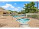 Community pool and spa area surrounded by brick patio and lush landscaping, perfect for relaxation at 476 Santa Cruz Ne Pl # C, St Petersburg, FL 33703