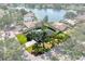 A serene aerial view of the home, set on a sprawling lot with lush greenery and mature trees at 500 Tallahassee Ne Dr, St Petersburg, FL 33702