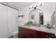 Updated bathroom featuring granite counters, modern fixtures, and a decorative mirror at 500 Tallahassee Ne Dr, St Petersburg, FL 33702