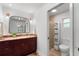 Well-lit bathroom features a granite countertop vanity and a glass door shower at 500 Tallahassee Ne Dr, St Petersburg, FL 33702