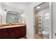 Updated bathroom featuring granite countertop, modern vanity, and glass-enclosed shower at 500 Tallahassee Ne Dr, St Petersburg, FL 33702