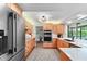 Bright kitchen with stainless steel appliances, light wood cabinets, and white countertops at 500 Tallahassee Ne Dr, St Petersburg, FL 33702