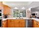 Updated kitchen features stainless steel appliances, light countertops, and a window overlooking the pool at 500 Tallahassee Ne Dr, St Petersburg, FL 33702