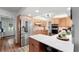 A spacious kitchen featuring light wood cabinets, stainless steel appliances, and bright countertop at 500 Tallahassee Ne Dr, St Petersburg, FL 33702