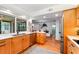 Bright kitchen features stainless steel appliances, lots of wooden cabinets, and breakfast bar with dining room views at 500 Tallahassee Ne Dr, St Petersburg, FL 33702