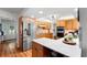 Bright kitchen featuring stainless steel appliances, shaker cabinets, quartz countertops, and open floor plan at 500 Tallahassee Ne Dr, St Petersburg, FL 33702
