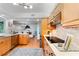 Bright kitchen featuring stainless steel appliances, lots of wooden cabinets, and a countertop with breakfast bar area at 500 Tallahassee Ne Dr, St Petersburg, FL 33702