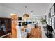 Open-concept living area with white walls, hardwood flooring, modern lighting, and stylish decor at 500 Tallahassee Ne Dr, St Petersburg, FL 33702