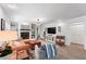 Cozy living room with a brick fireplace, comfortable seating, and bright lighting at 500 Tallahassee Ne Dr, St Petersburg, FL 33702