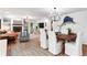 Spacious living and dining area featuring hardwood floors, stylish decor, and ample natural light at 500 Tallahassee Ne Dr, St Petersburg, FL 33702