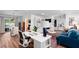 Bright home office with large desk, bookshelves, and view to pool patio at 500 Tallahassee Ne Dr, St Petersburg, FL 33702