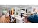 Bright home office featuring a large desk, comfortable seating, with views of the outdoor pool and living area at 500 Tallahassee Ne Dr, St Petersburg, FL 33702