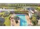 Aerial view of the pool, clubhouse, and scenic lakeside, showcasing community amenities at 5609 Silver Sun Dr, Apollo Beach, FL 33572