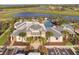 Community clubhouse and pool area, featuring palm trees, seating, and well-maintained landscaping at 5609 Silver Sun Dr, Apollo Beach, FL 33572