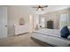 Bright bedroom featuring a ceiling fan, a nautical theme, and a window with natural light at 5609 Silver Sun Dr, Apollo Beach, FL 33572