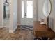 Inviting entryway with wood-look tile flooring and a view of the living spaces at 5609 Silver Sun Dr, Apollo Beach, FL 33572