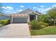Charming single-Gathering home boasting a well-maintained lawn and attached two-car garage in a desirable neighborhood at 5609 Silver Sun Dr, Apollo Beach, FL 33572