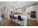 Modern kitchen with white cabinets, marble countertops, and stainless steel appliances at 5609 Silver Sun Dr, Apollo Beach, FL 33572