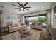 Spacious living room with sliding glass doors leading to a screened pool area at 5609 Silver Sun Dr, Apollo Beach, FL 33572