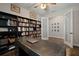 Office with large desk, world map, and bookshelf at 5609 Silver Sun Dr, Apollo Beach, FL 33572
