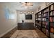 Spacious home office with built-in bookshelves and a world map at 5609 Silver Sun Dr, Apollo Beach, FL 33572