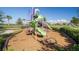 Modern playground equipment nestled in a lush landscape, offering a safe and enjoyable play area at 5609 Silver Sun Dr, Apollo Beach, FL 33572