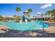 Enjoy the sunshine while relaxing at the community pool with splash pad and waterslides at 5609 Silver Sun Dr, Apollo Beach, FL 33572