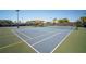 Well-maintained tennis court with shade and lighting for year-round play at 5609 Silver Sun Dr, Apollo Beach, FL 33572