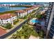 High-angle view of condos, showcasing the neighborhood pool and landscaping near the bay at 5823 Bowen Daniel Dr # 606, Tampa, FL 33616