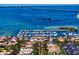 Breathtaking aerial view of a waterfront community, showcasing a marina, lush landscaping and stunning ocean scenery at 5823 Bowen Daniel Dr # 606, Tampa, FL 33616